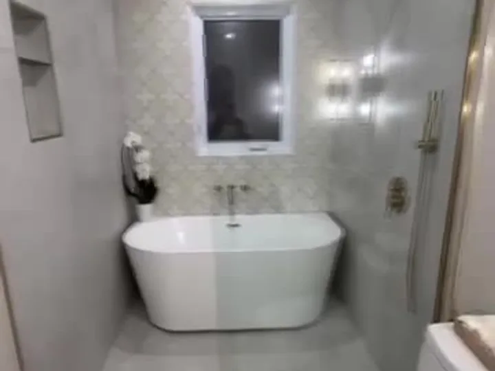 Bathroom extension with a curbless shower, After
